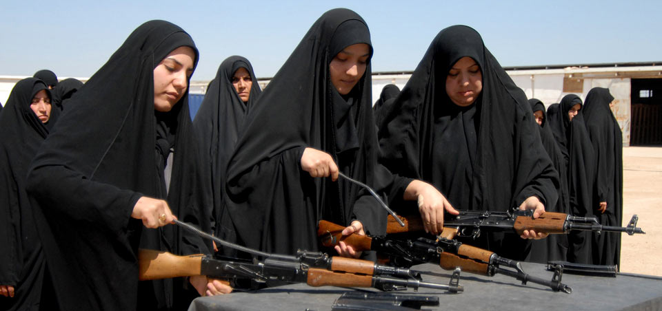 Iraqi female recruits disassemble AK-47 assault rifles during weapons training for recruits in basic training at the Iraqi Police Academy in Karbala