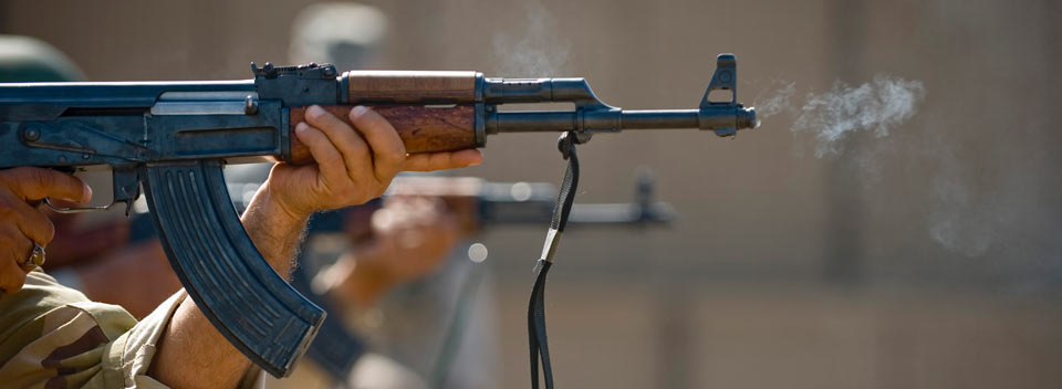 Iraqi airmen fire AK-47s during firing drills