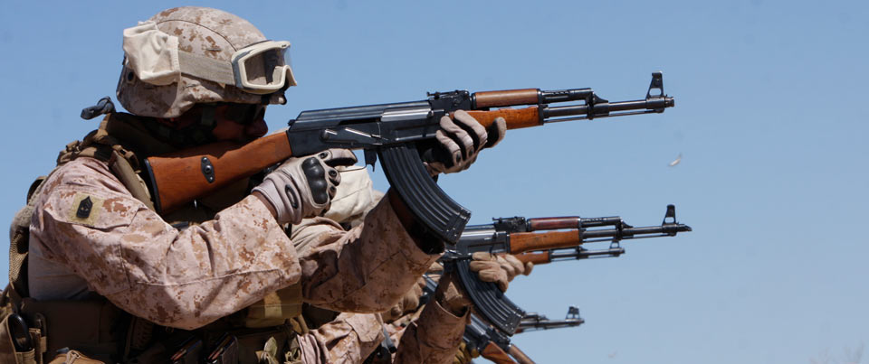 Marines training with the Combat Center’s Advisor Training Group fire AK-47s during a Combat Marksmanship Program shoot